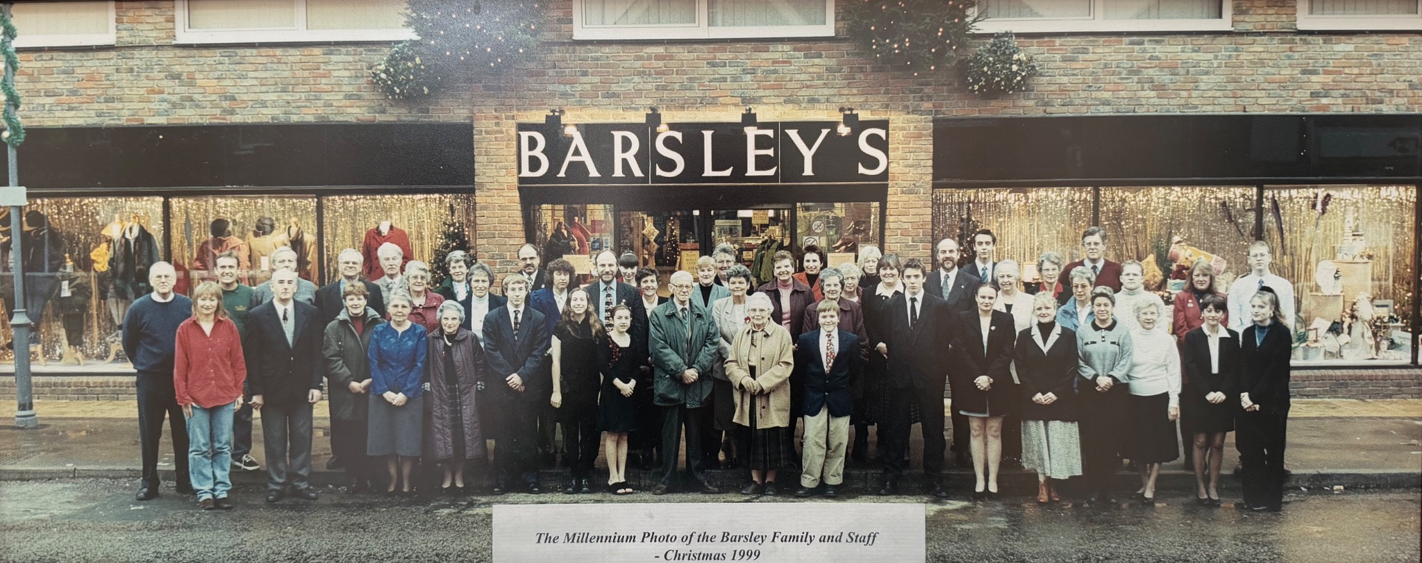 Barsleys family and staff gathered outside the store at Christmas 1999